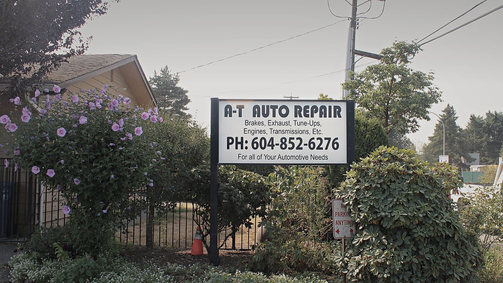 The A-T Auto Repair sign at the roadside on Townline Road, Abbotsford.