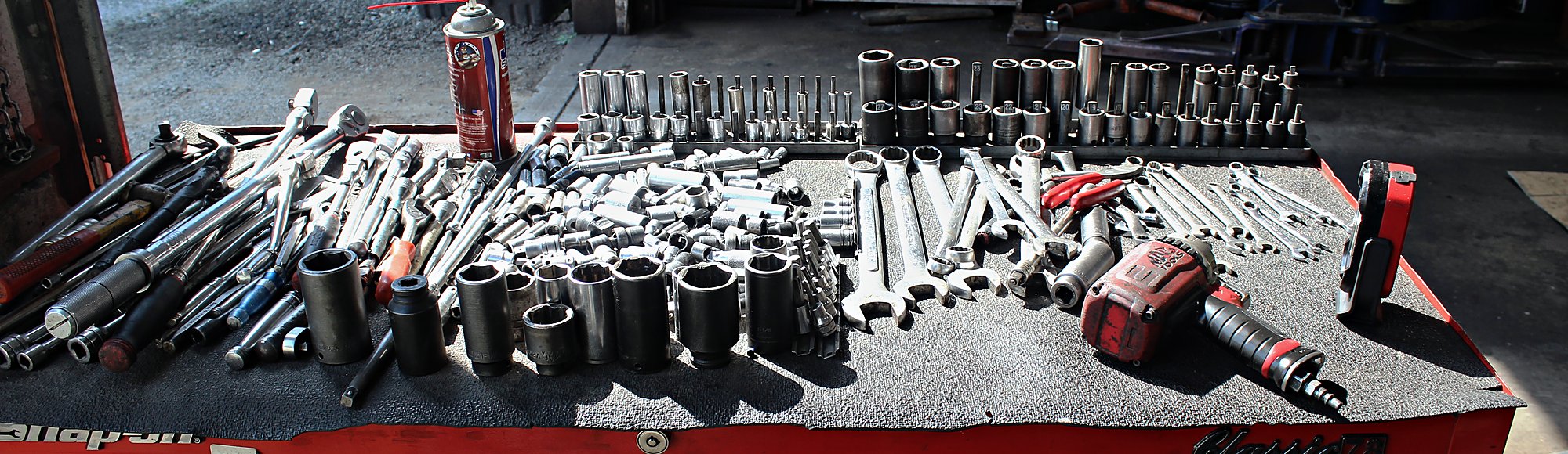 Sockets and wrenches laid out on the Snap-on box between jobs.