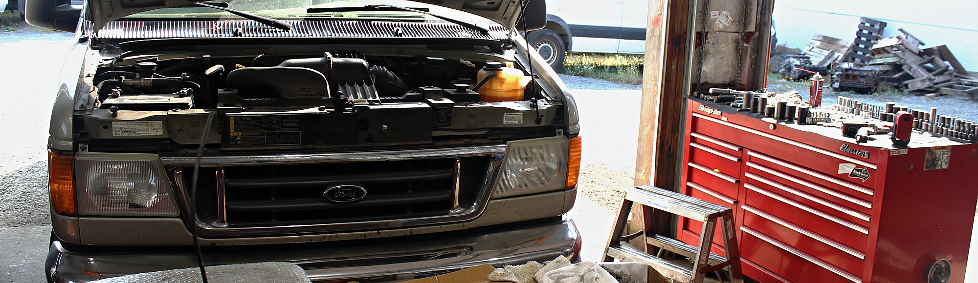 A work van in the bay, partway through repair.