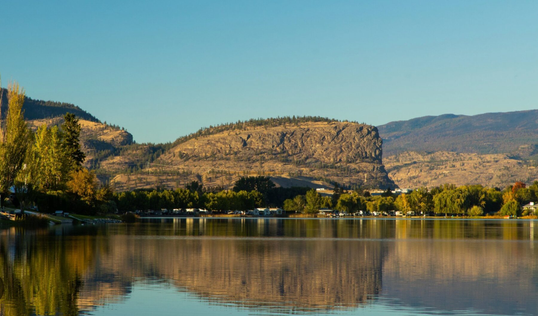 Golden-hour reflection on the lake below the bluffs near Chilliwack, BC